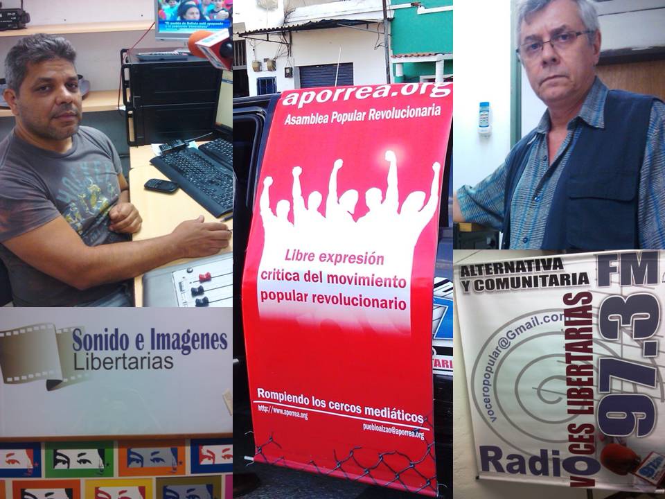 Roberto Sanabria y Gonzalo Gómez, con los emblemas de la RVL 97.3 FM y de Aporrea.org
