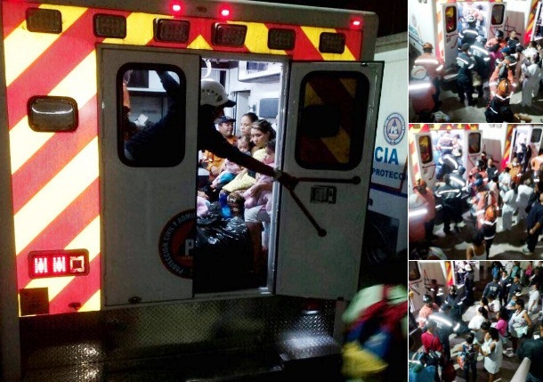 Instantes en que una ambulancia evacua esta noche a numerosos pacientes infantiles hospitalizados en centro médico en El Valle