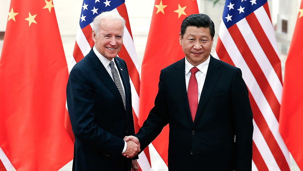 Xi Jinping y Joe Biden durante un encuentro en Pekín, 4 de diciembre de 2013